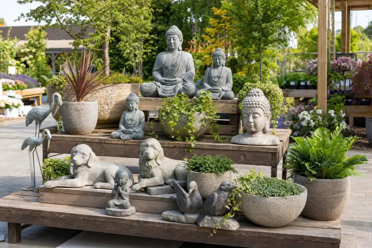 Garden Ornaments & Statues collection at Pengelly Cornwall showing stone statues, birdbaths and potted plants on display