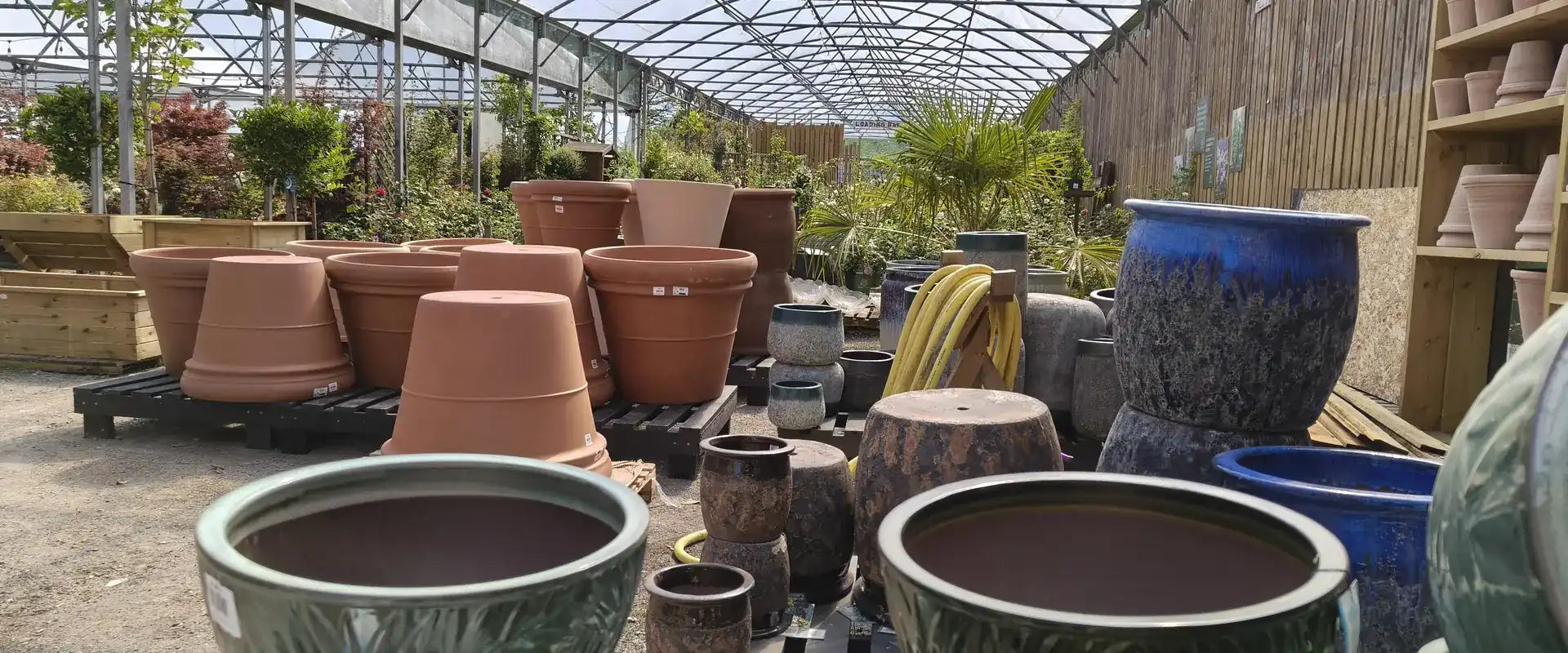 Garden pots and ornamental planters on display at Pengelly Garden Centre in Cornwall
