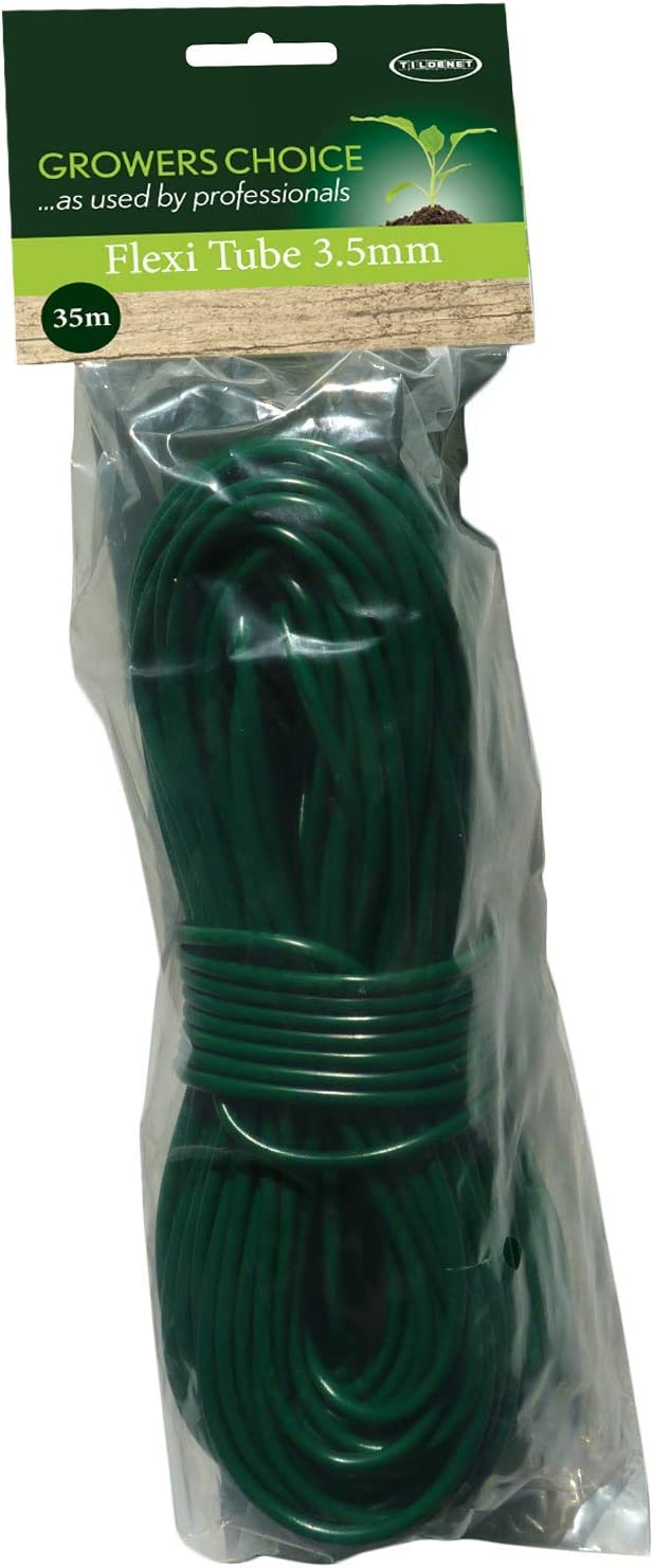 Green expandable Flexi garden hose with spray nozzle coiled on lawn