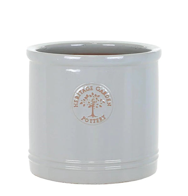 Grey cylindrical concrete planter pot with drainage hole, modern outdoor garden container
