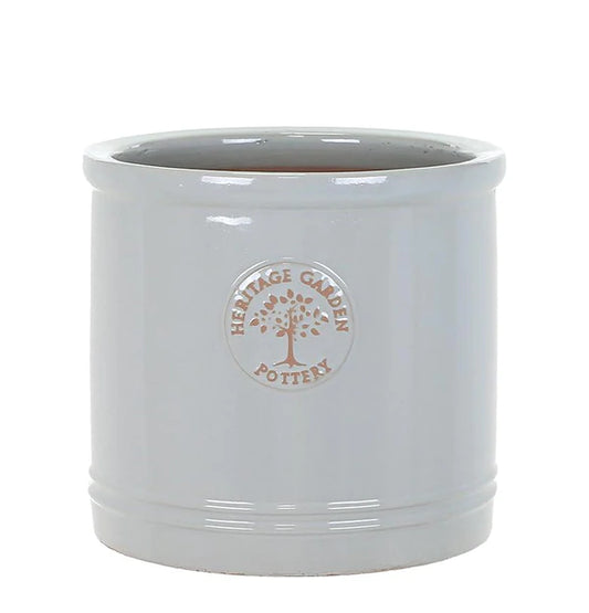 Grey cylindrical concrete planter pot with drainage hole, modern outdoor garden container
