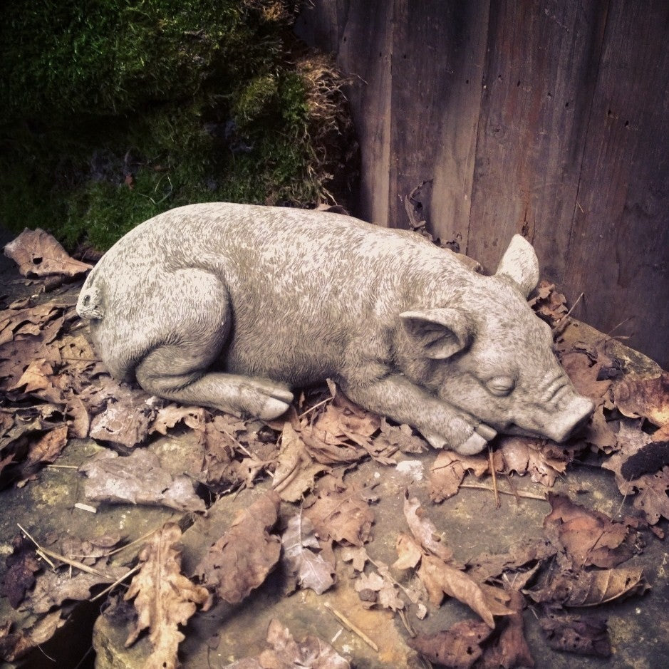 small pink ceramic pig garden ornament statue with painted features for outdoor decoration
