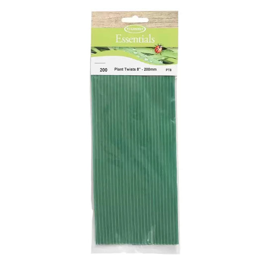 green plant twist ties securing young stems to bamboo cane support in patio planter